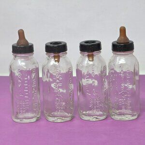 Vintage Evenflo Glass Baby Doll Bottles With Black Caps & Brown Nipples Set Of 4